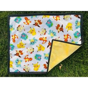 Pokémon doll quilt with a yellow Minky back 22”x18”